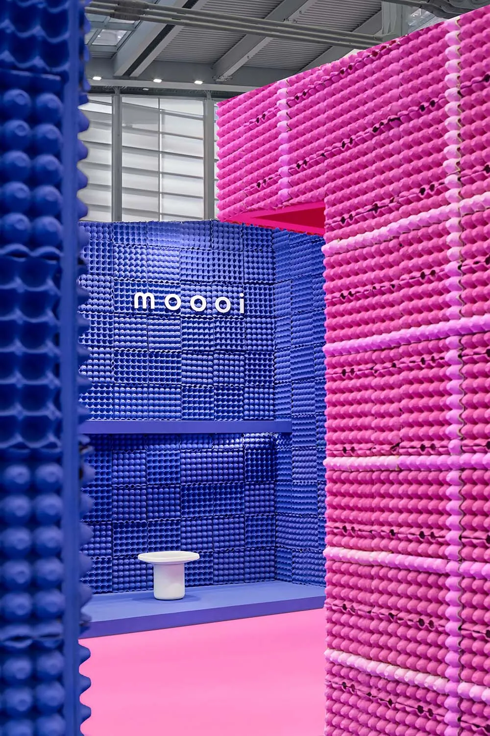 An installation art made from modular blue and pink plastic units.