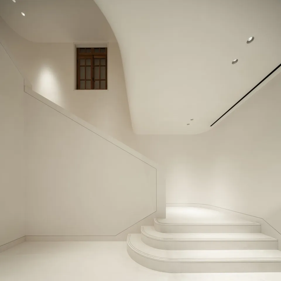 Minimalist interior design featuring concrete stairs