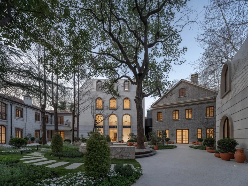 Modern exterior of a residential house featuring brick and stone materials.