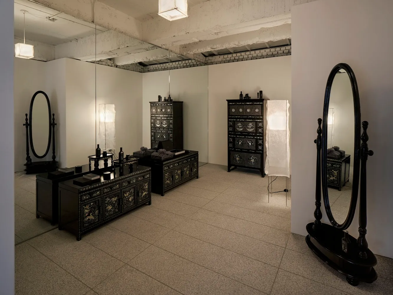 A retail storefront with wooden cabinets and mirrors.
