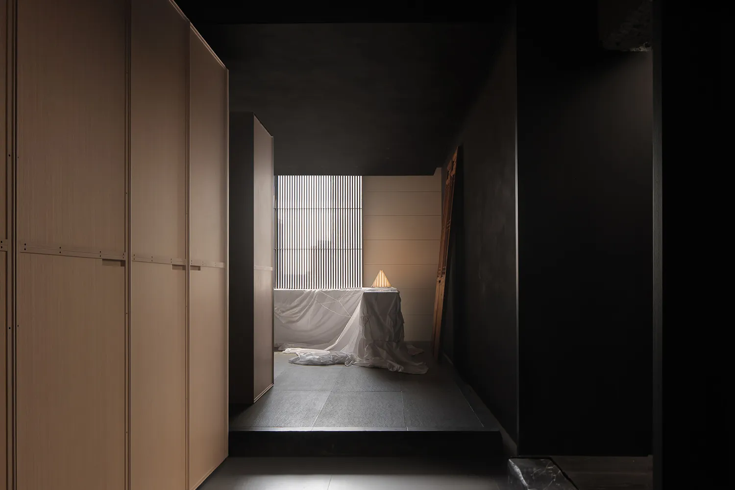 A minimalist bedroom featuring modern, light-colored wooden furniture and a simple, elegant design.