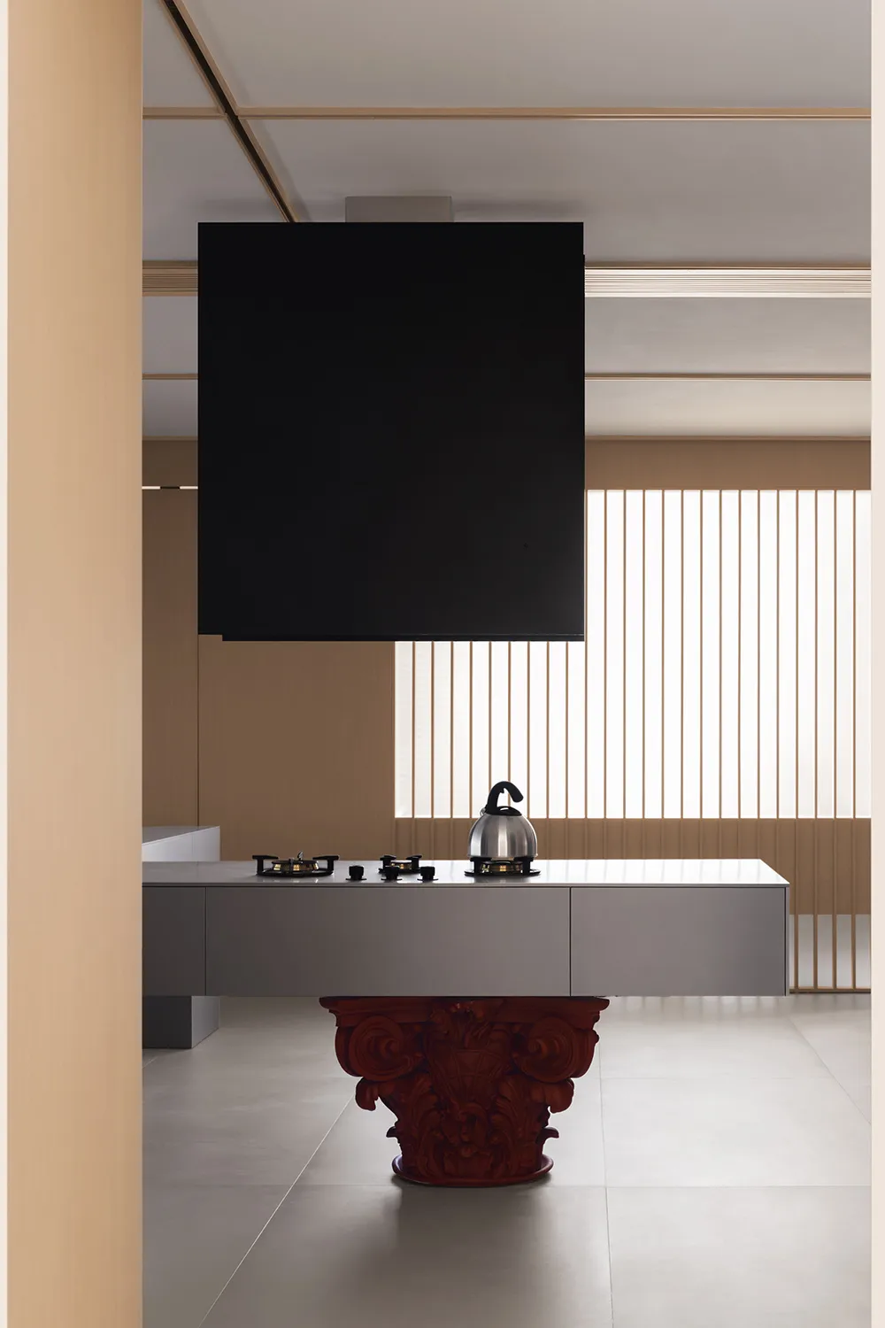 A modern minimalist kitchen featuring sleek, contemporary design elements and a minimalist color palette with some natural li