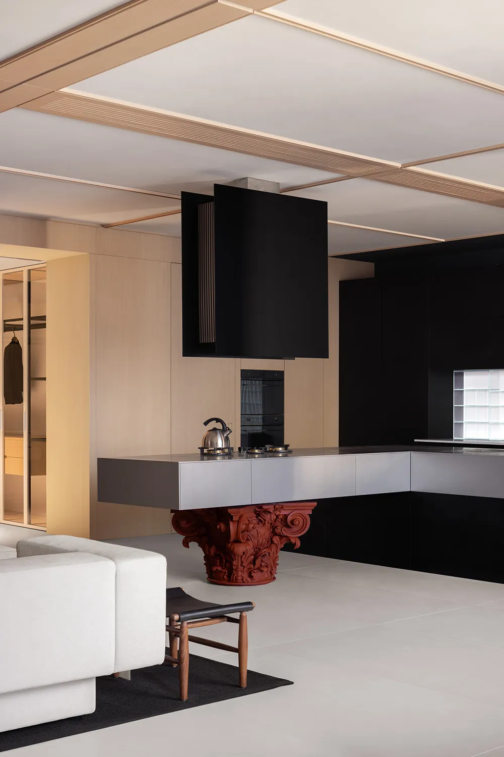 A modern kitchen with wooden finishes and black accents.