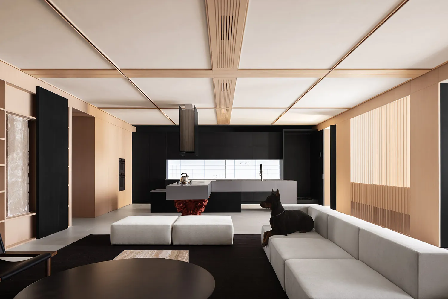Modern minimalist living room featuring a white sofa, white ottomans, and a wooden floor with minimalist decor.