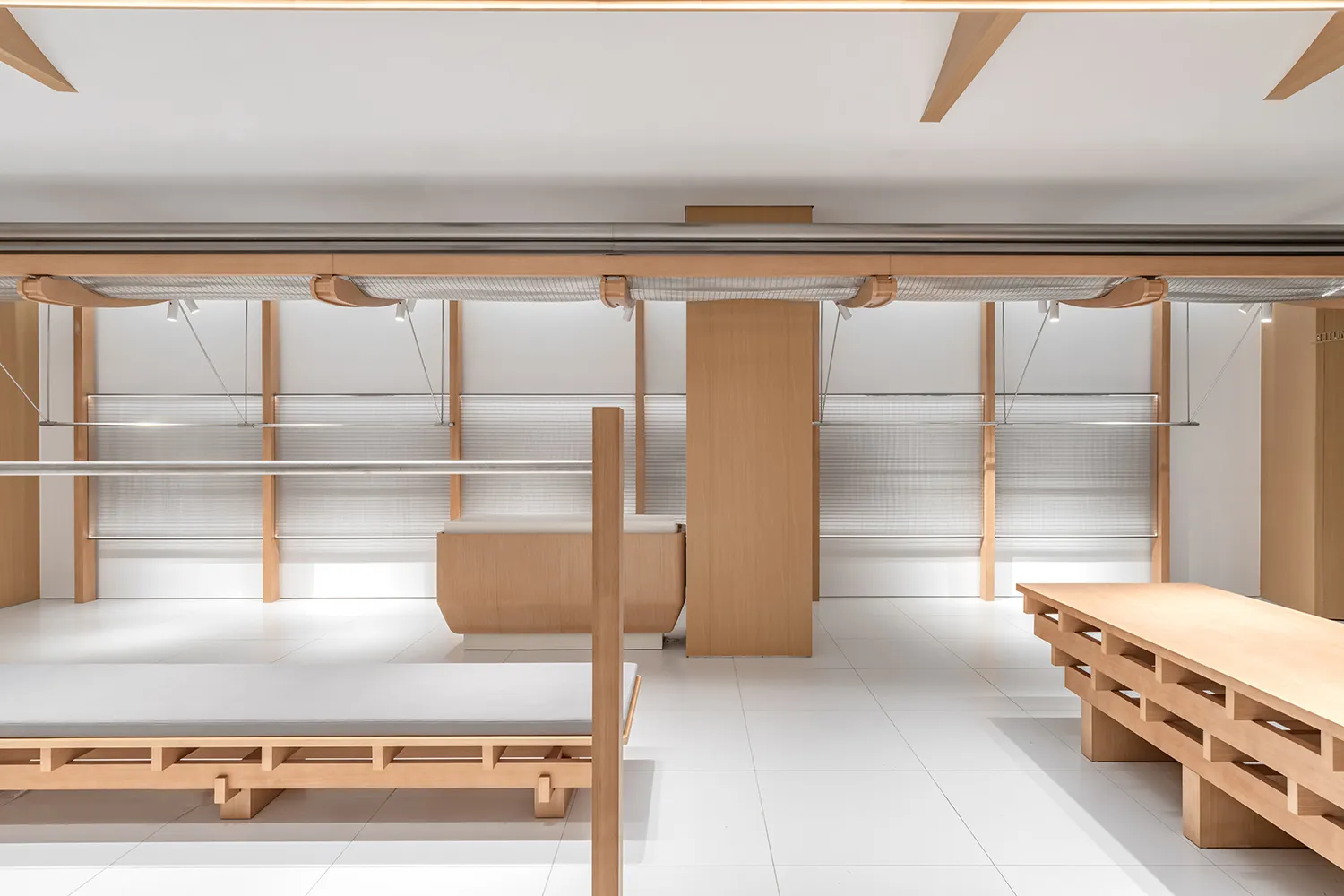 White and wooden minimalist retail store interior design showcasing clean lines and functional layout.