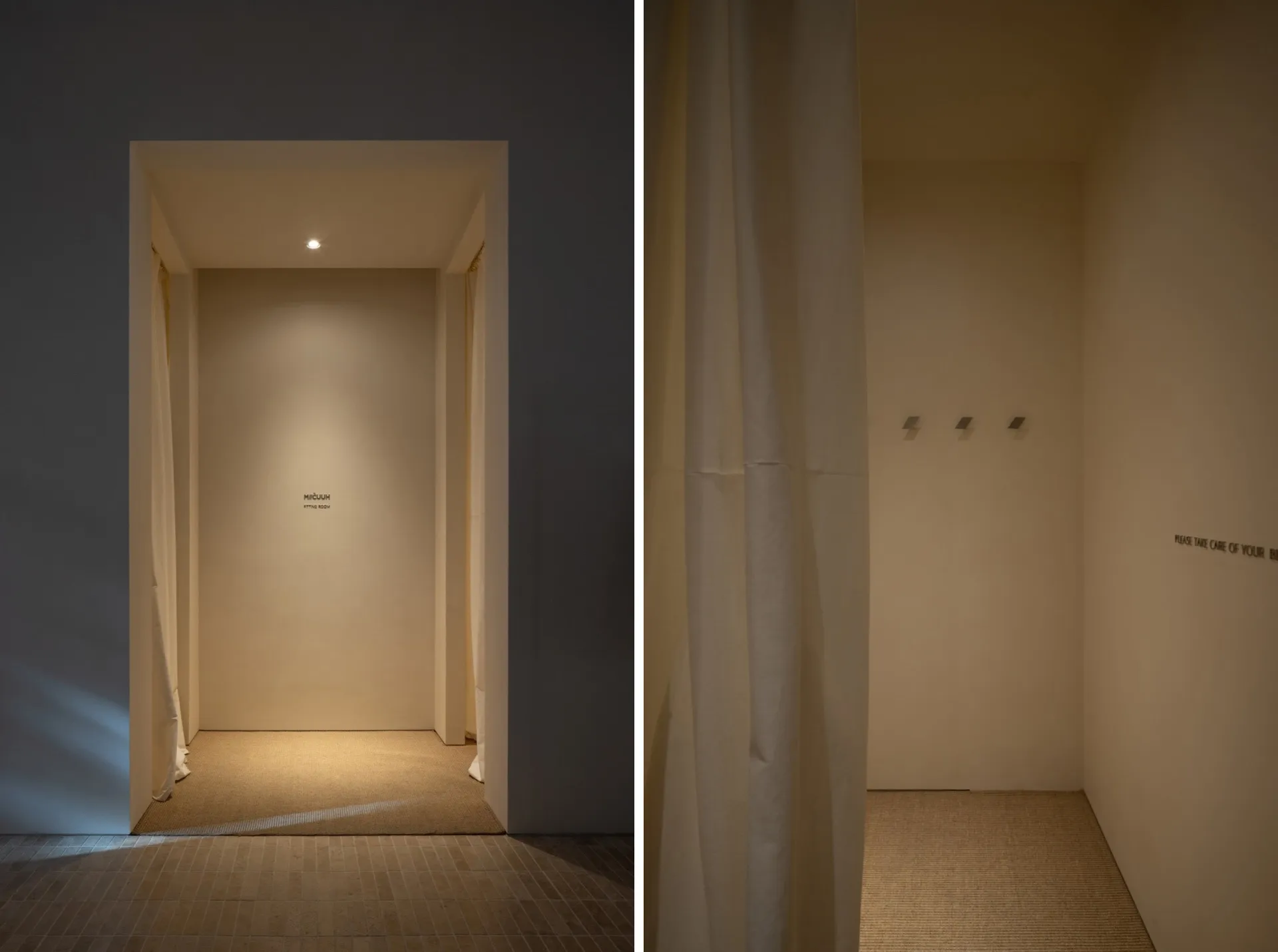 Minimalist retail fitting room with neutral colors and simple design.