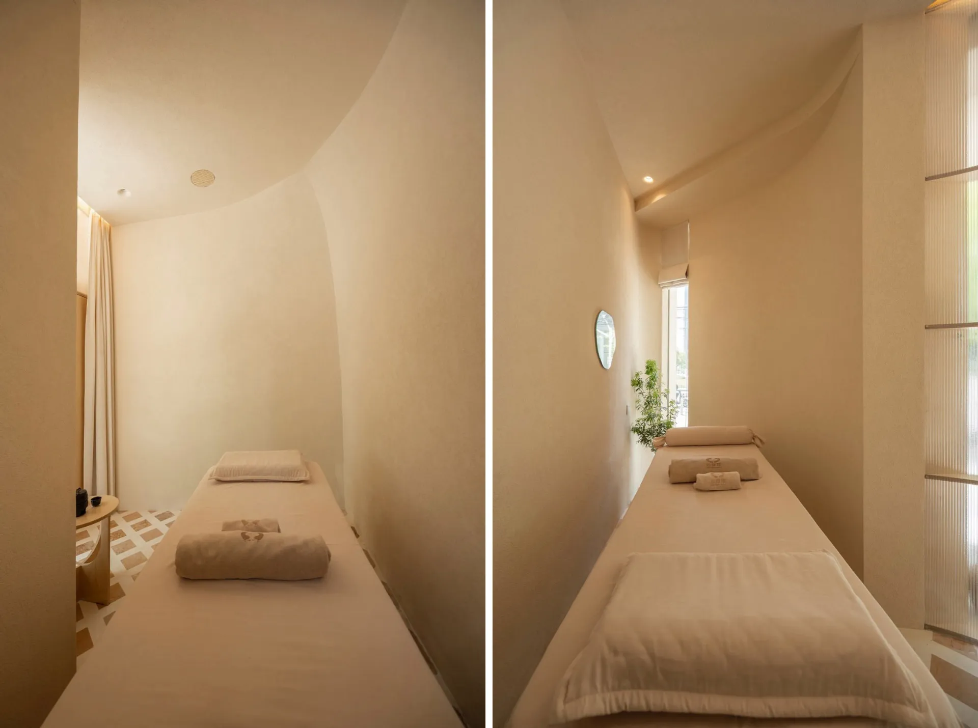A minimalist spa room with soft-touch materials features a long massage table.