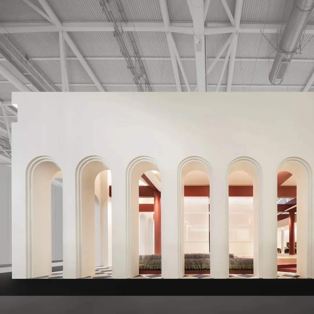 A modern office interior with concrete walls and arches.