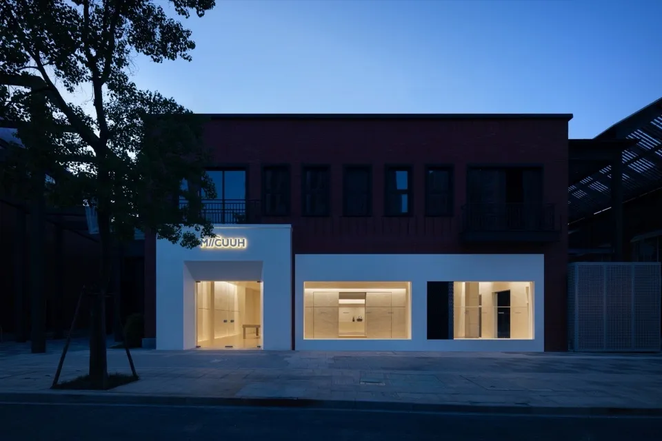 Modern storefront with glass windows and concrete base