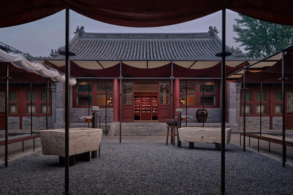 Stone and wood traditional Chinese building with glass windows