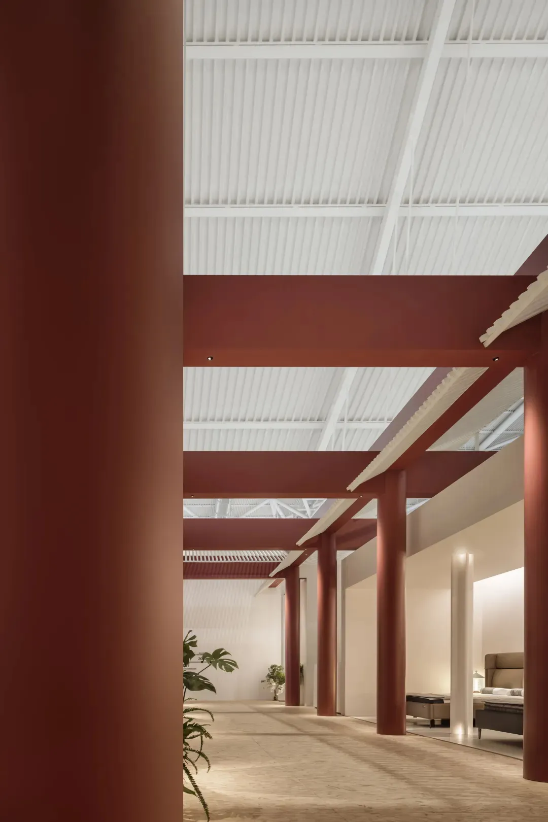 Modern office space featuring industrial-style metal columns.