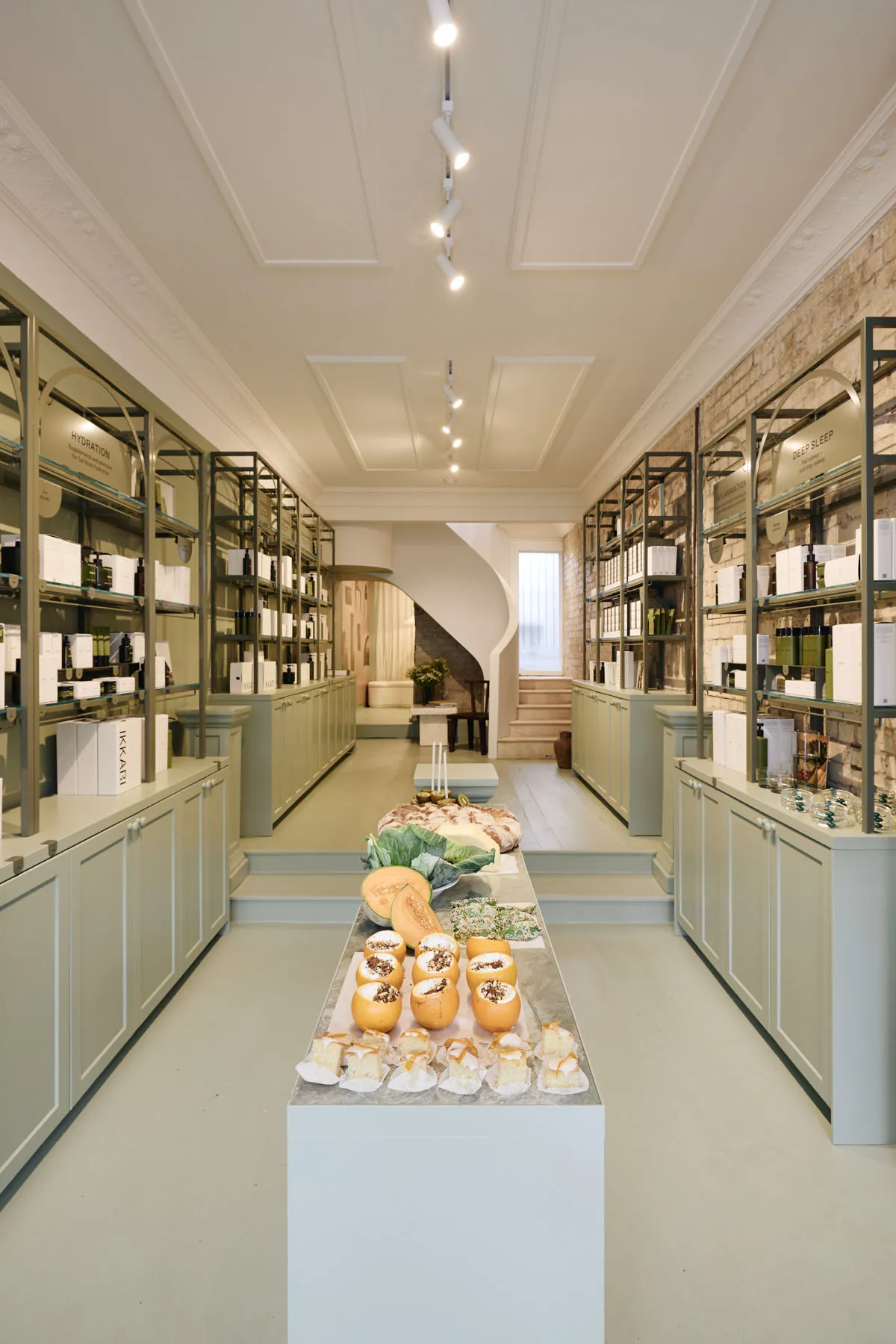 A modern retail shop interior featuring concrete and brick materials.