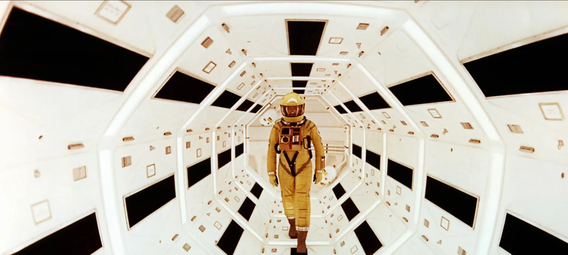 Astronaut floating in a metallic space tunnel