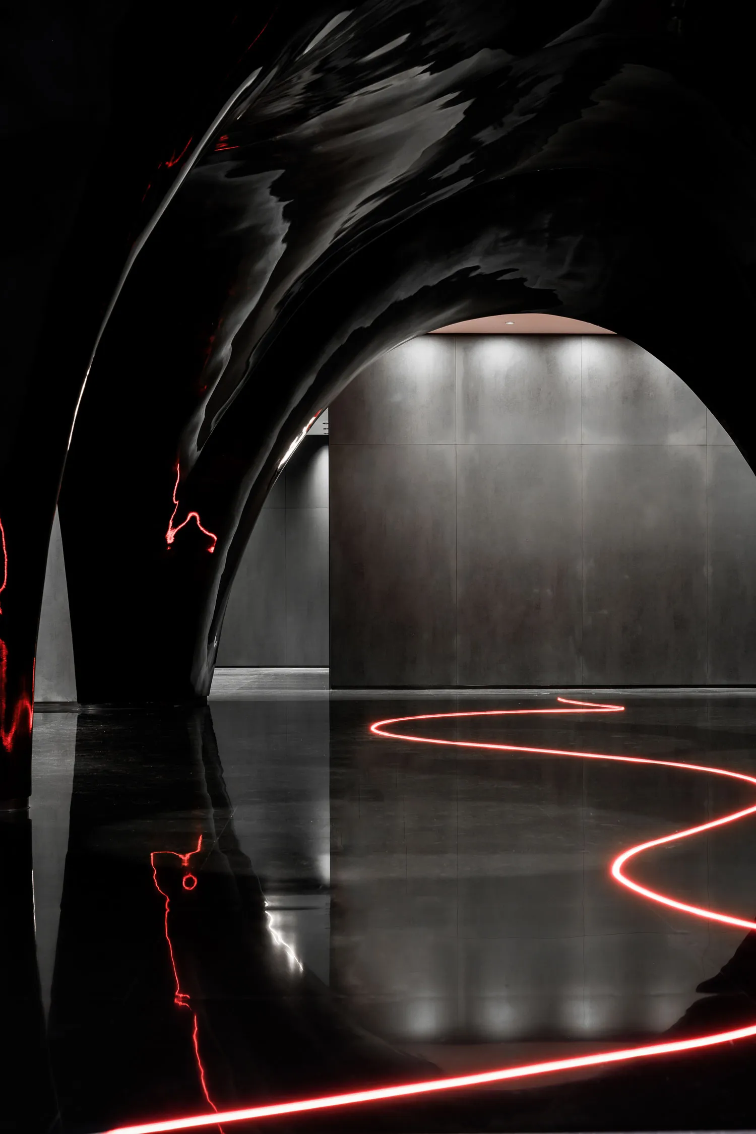 A sleek, modern interior space featuring a glass architectural element.