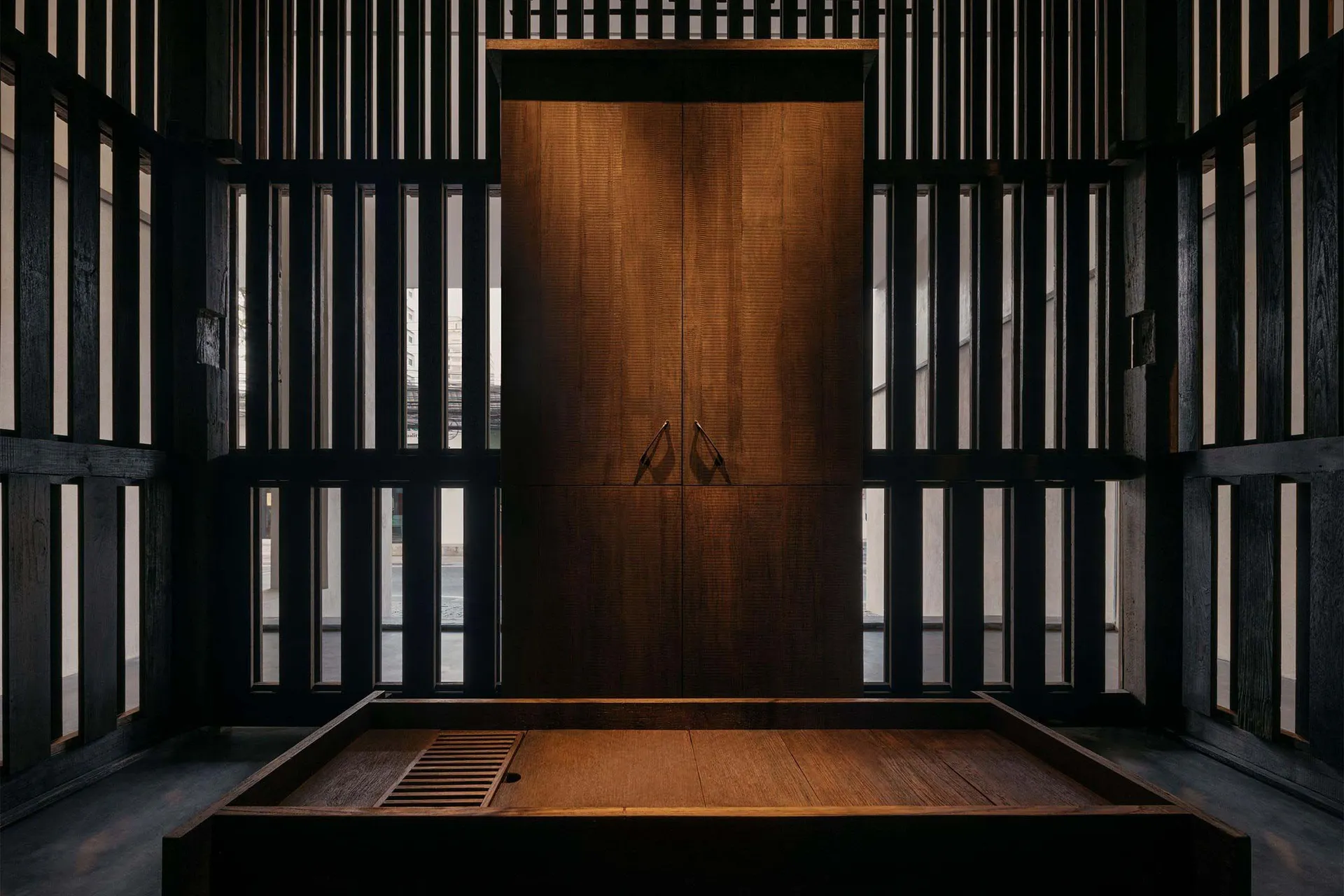 A modern interior featuring wooden doors with metal handles.
