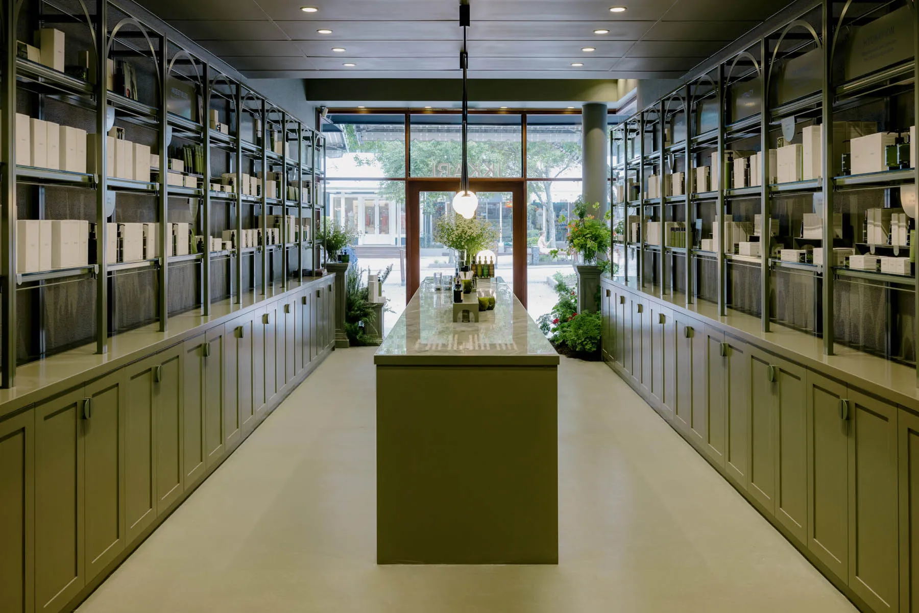 A modern retail storefront with concrete and marble finishes.