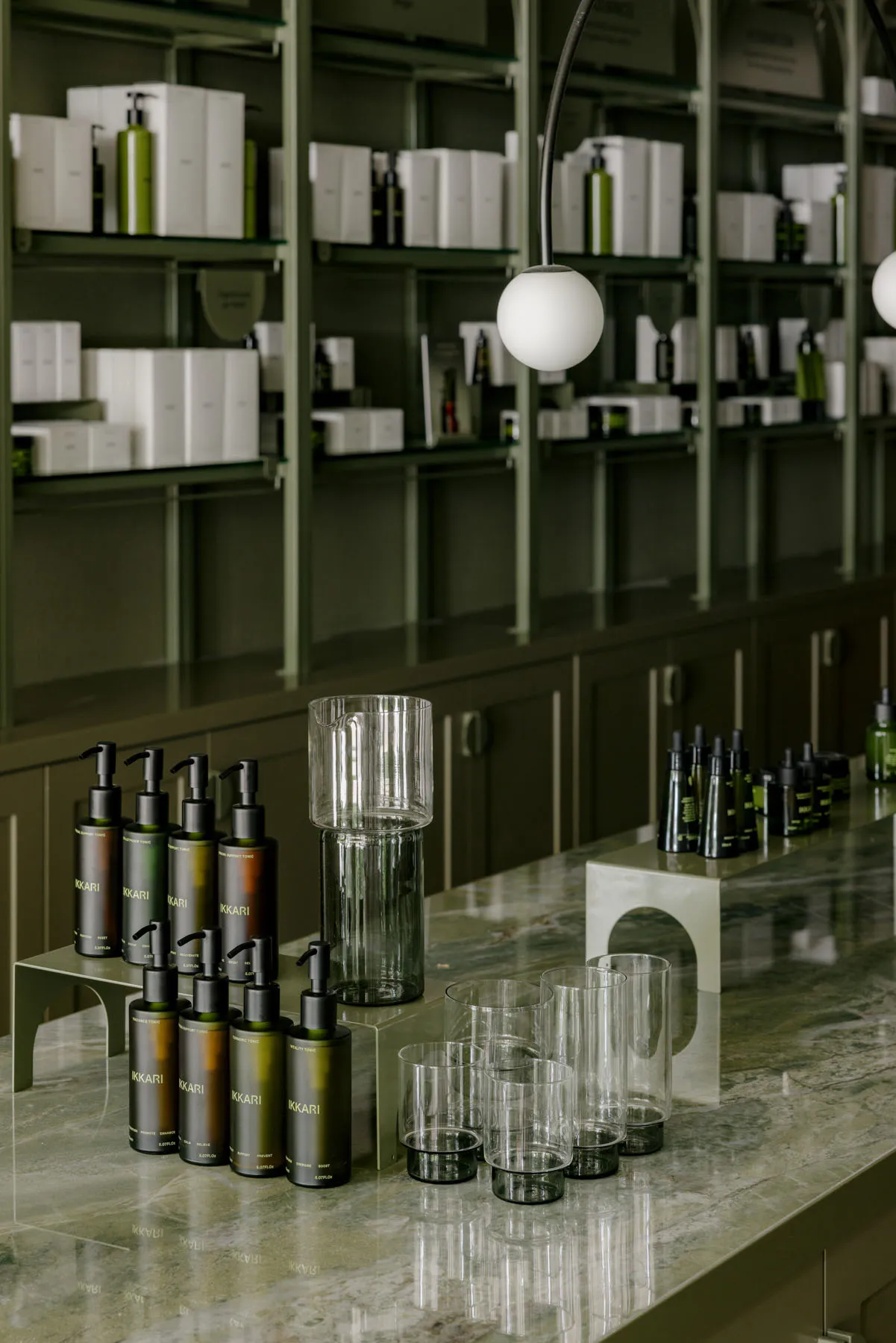 A retail storefront with glass and marble materials