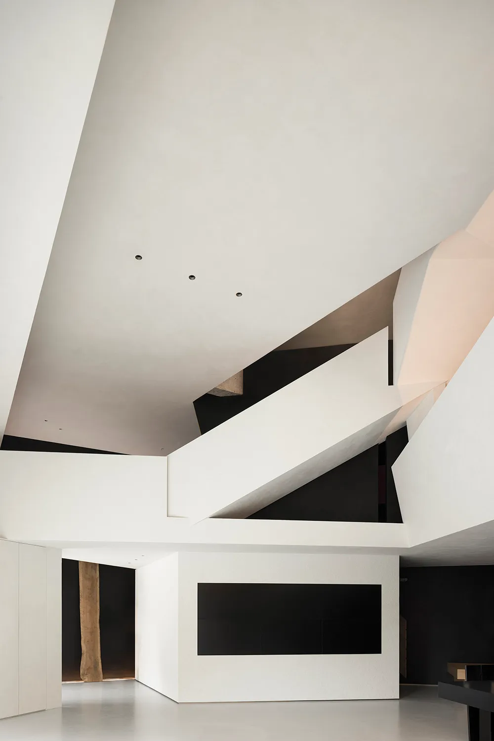 Modern interior design featuring minimalist concrete and wood elements.