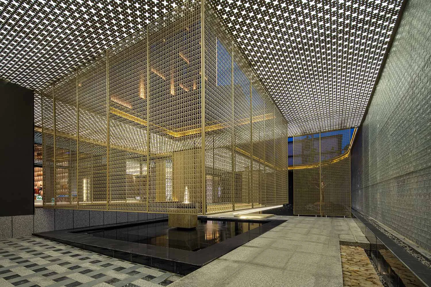 A modern shop interior featuring a metal striped ceiling and concrete floor.