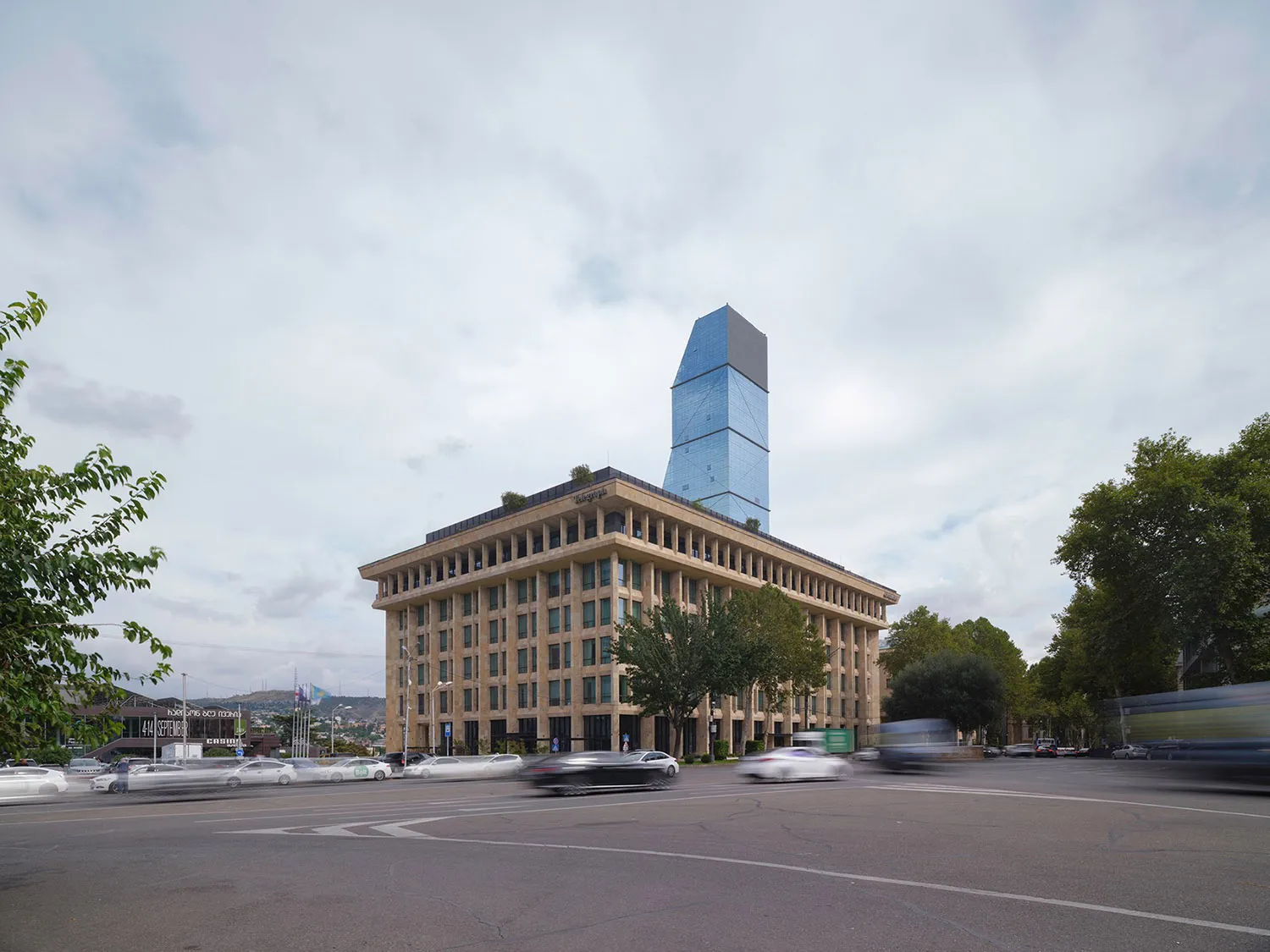 A modern building with a glass and stone exterior.
