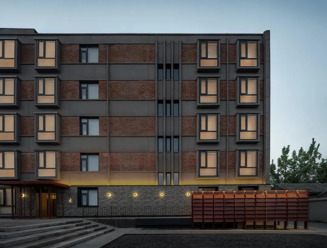 Modern building exterior featuring brick material.