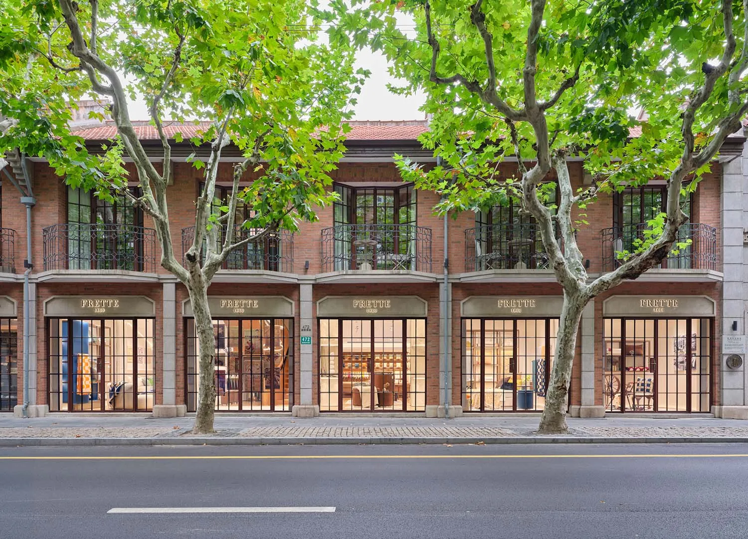 Modern storefront with brick, glass, and metal architectural elements