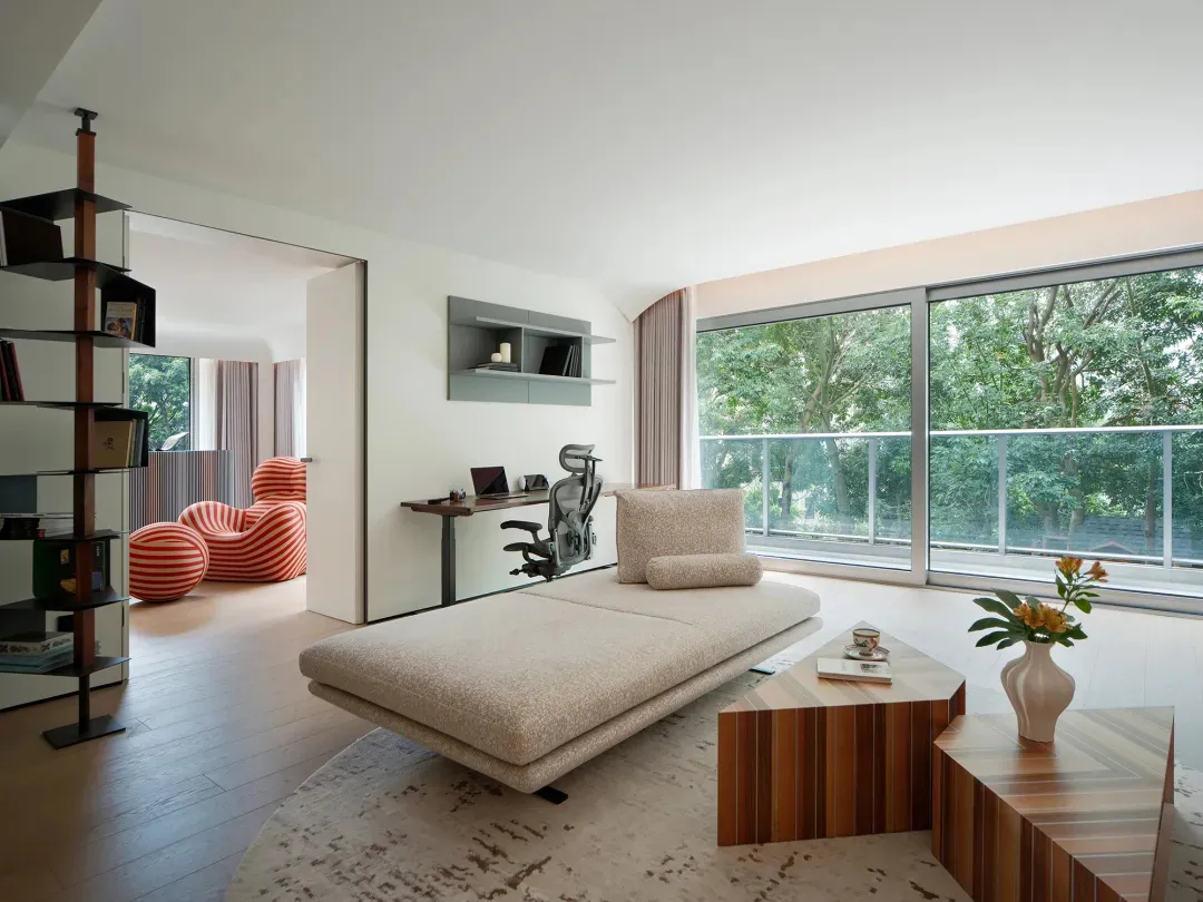 A modern living room with wooden structures, a comfortable seating area, and natural light.