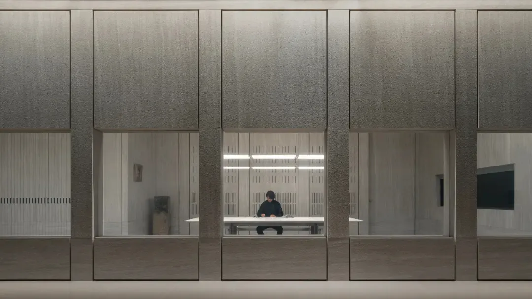 A modern office space featuring glass walls.