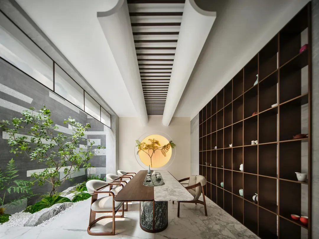 Modern library with bookshelves made of wood, stone, and metal.