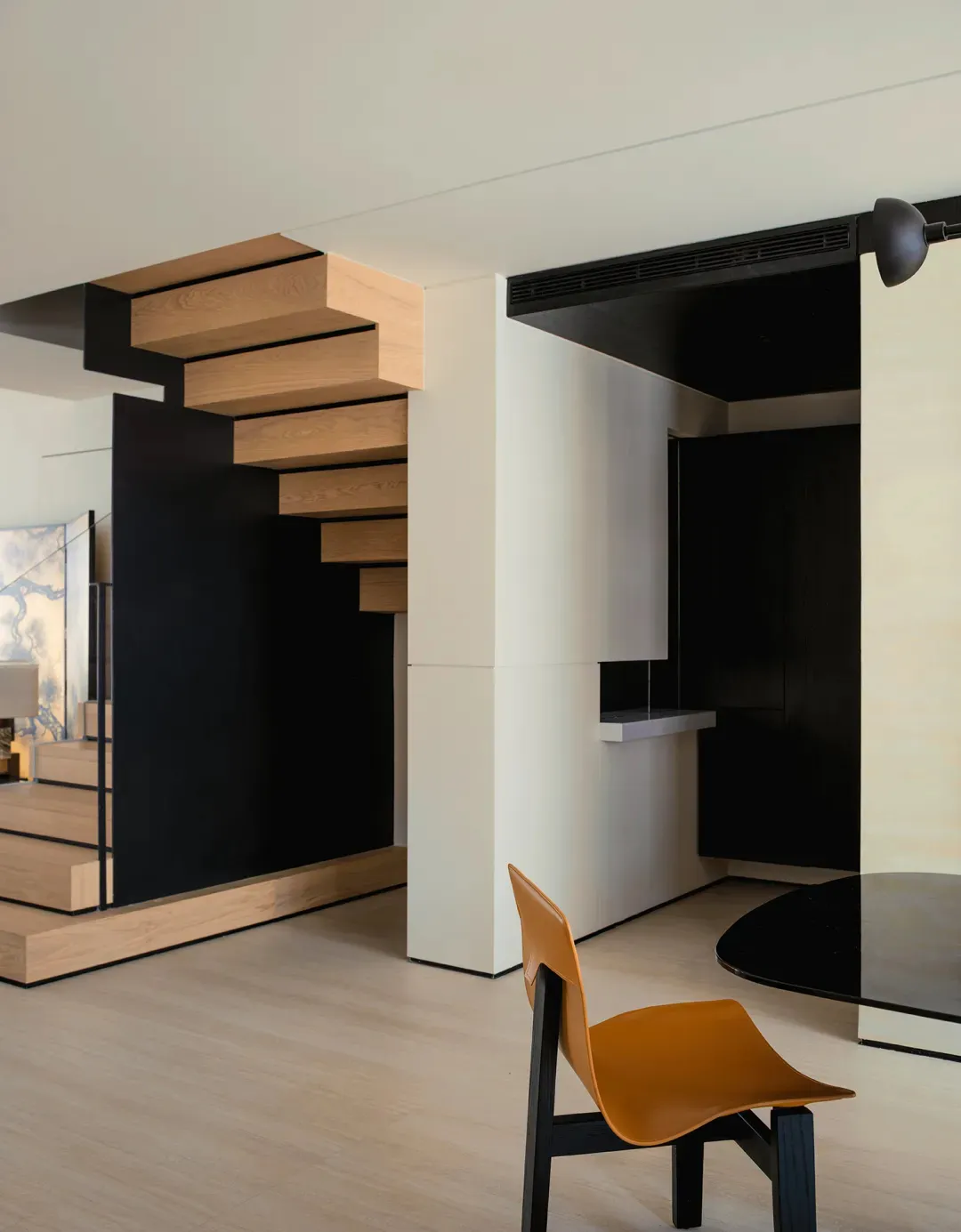 Modern dining room with concrete table and minimalist design.