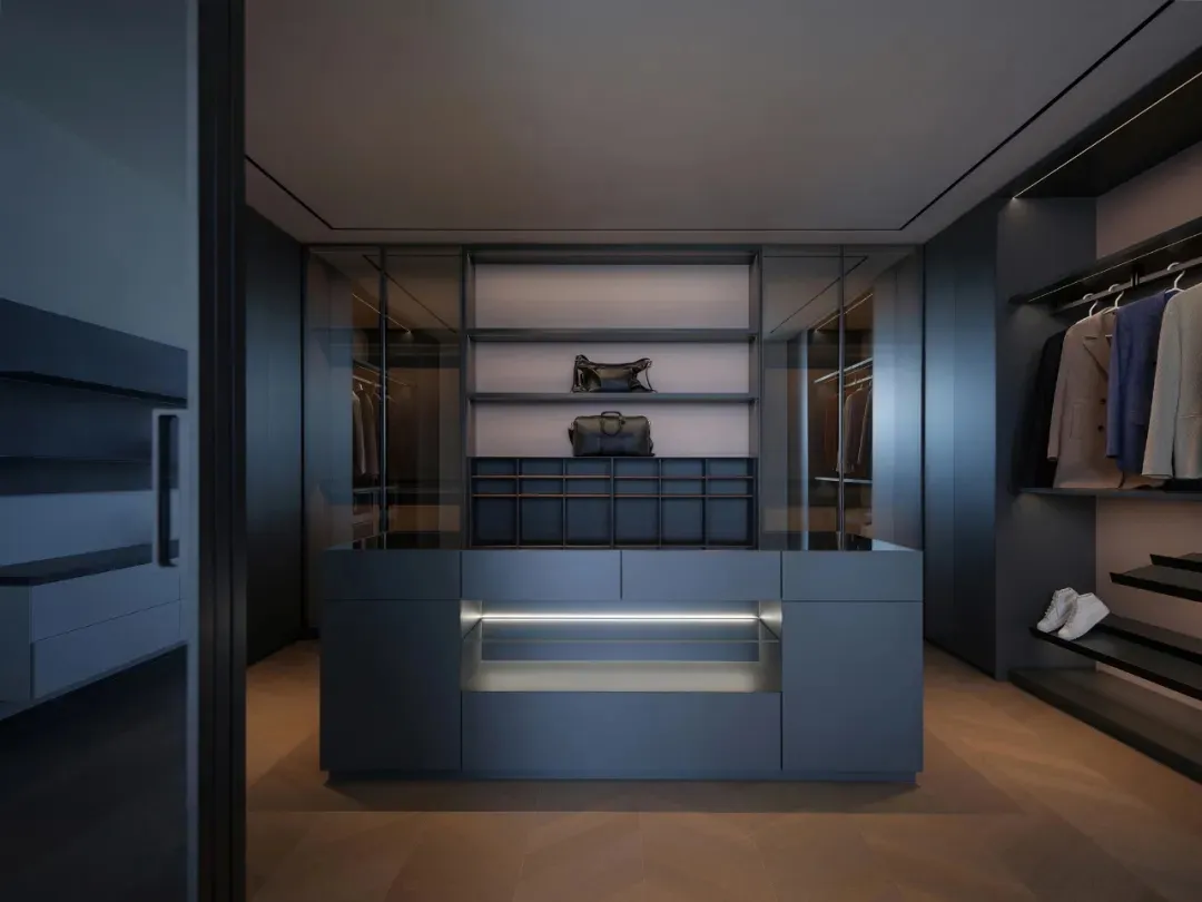 Modern closet with blue metallic shelves and drawers, featuring a central island with additional storage and lighting.