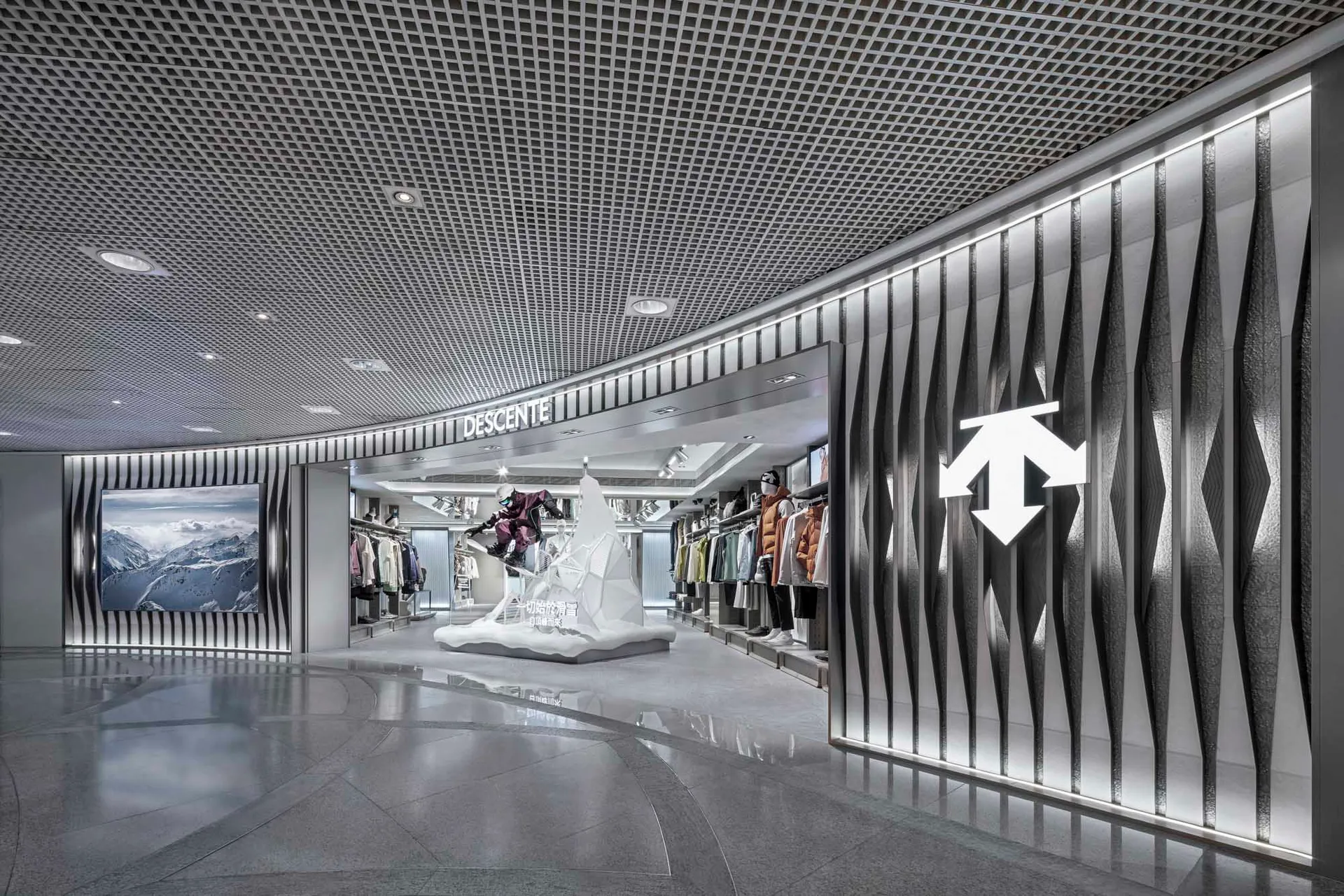 Modern storefront with metallic display case, glass windows, and concrete floor.