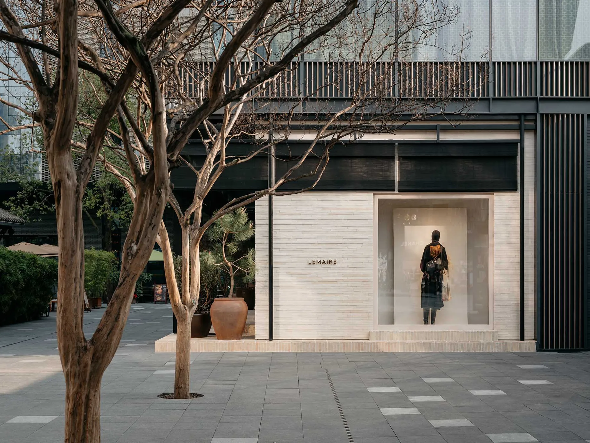 A modern retail storefront with mixed materials and a minimalist design.