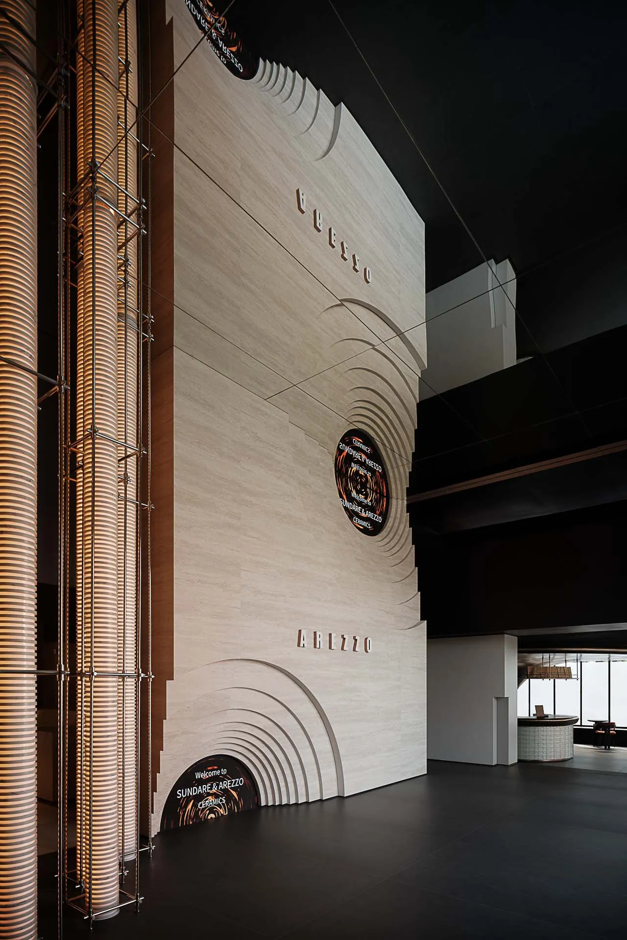 Modern minimalist lobby with white marble walls and columns.