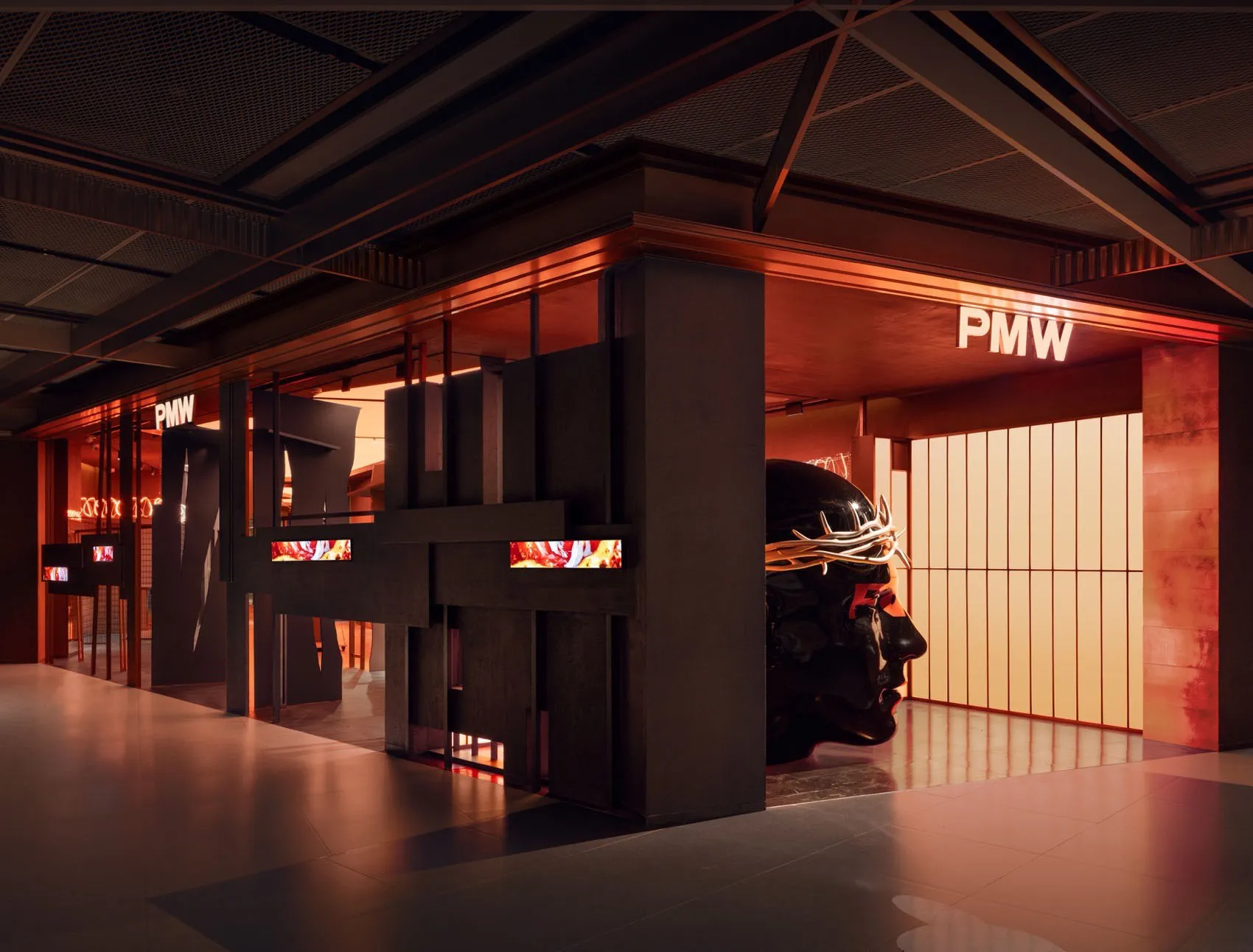 Modern retail storefront with exposed concrete walls and metal accents.