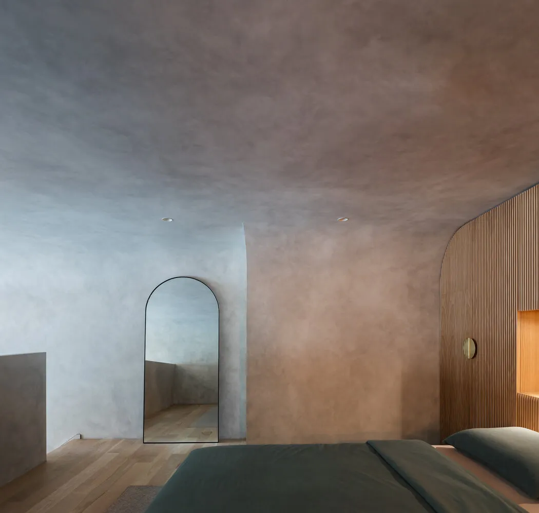 Modern bedroom with minimalist design and textured plaster walls