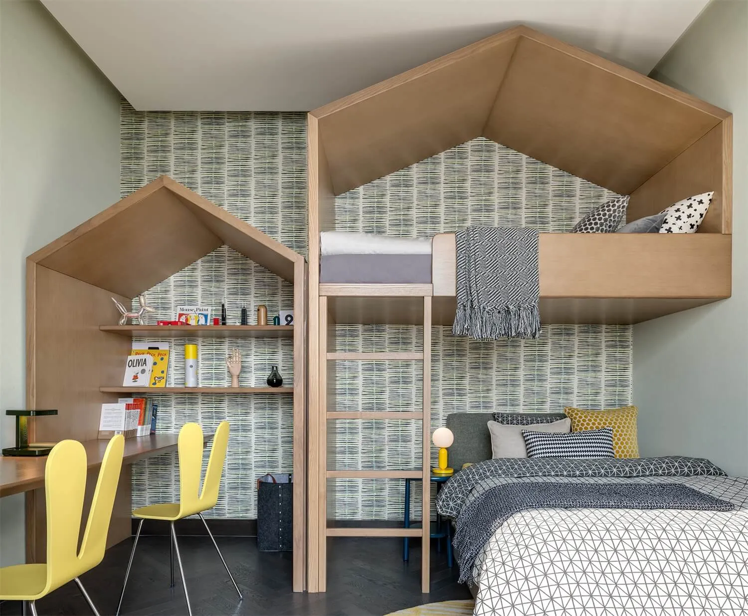 A modern children's bedroom featuring a wooden bunk bed with a roof and built-in shelves.