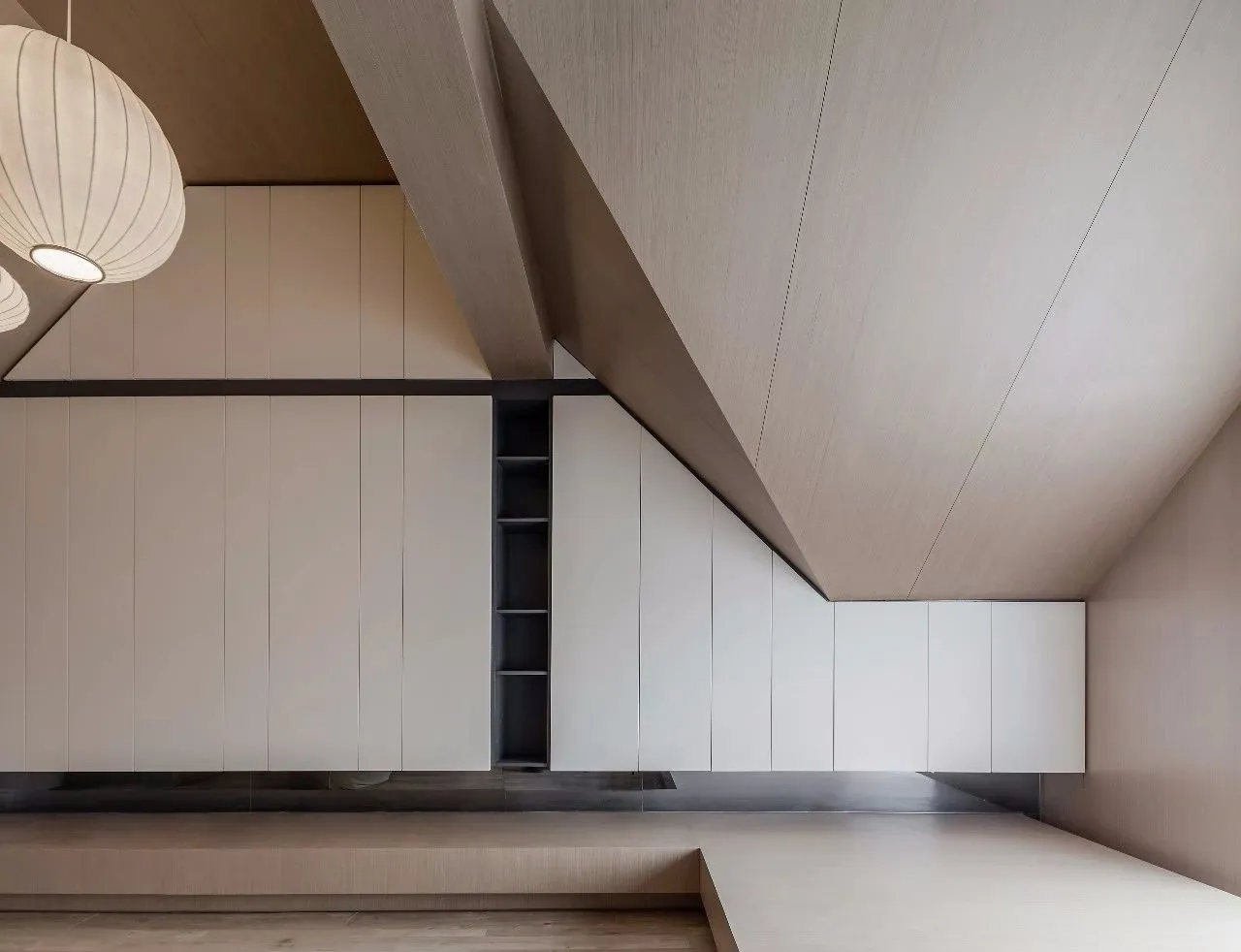 A modern minimalist interior featuring wooden elements.