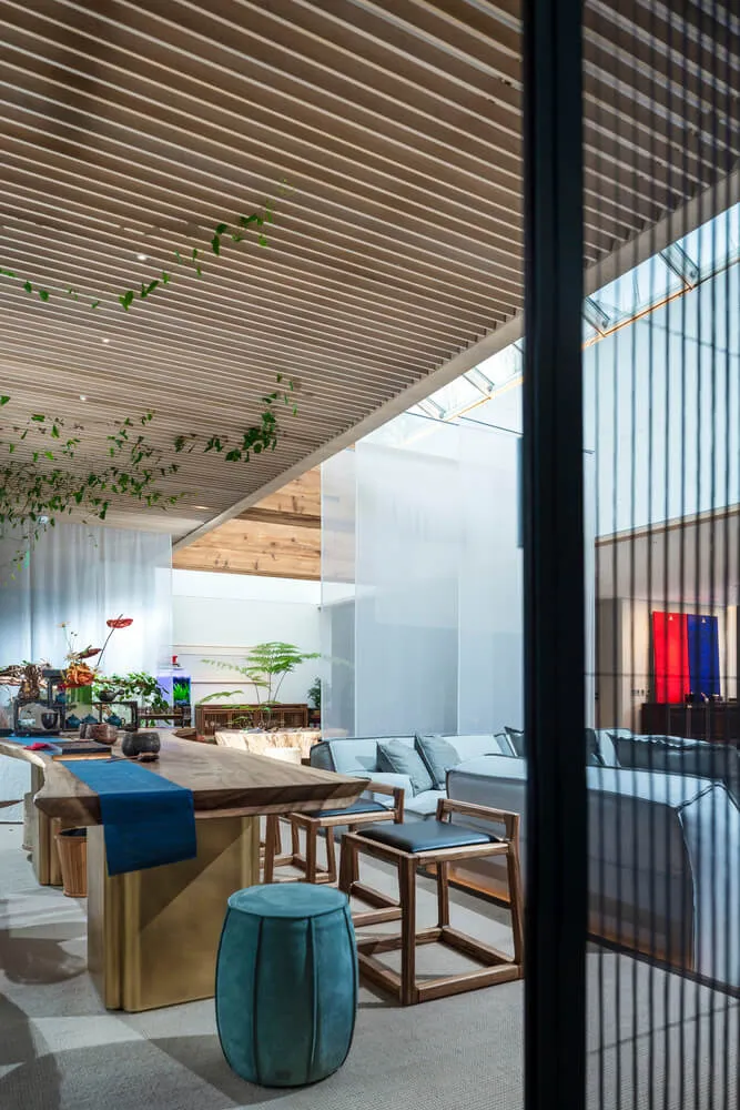Modern minimalist living room featuring wooden furniture and materials.