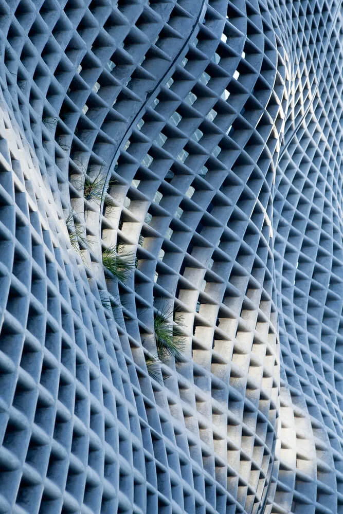 Close-up view of a modern architectural design featuring geometric patterns and concrete material.