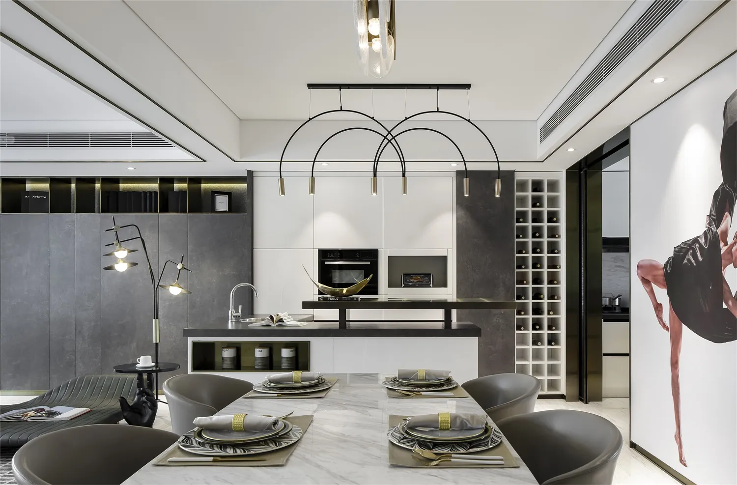 Modern kitchen with marble countertops, glass cabinets, and a white center island.