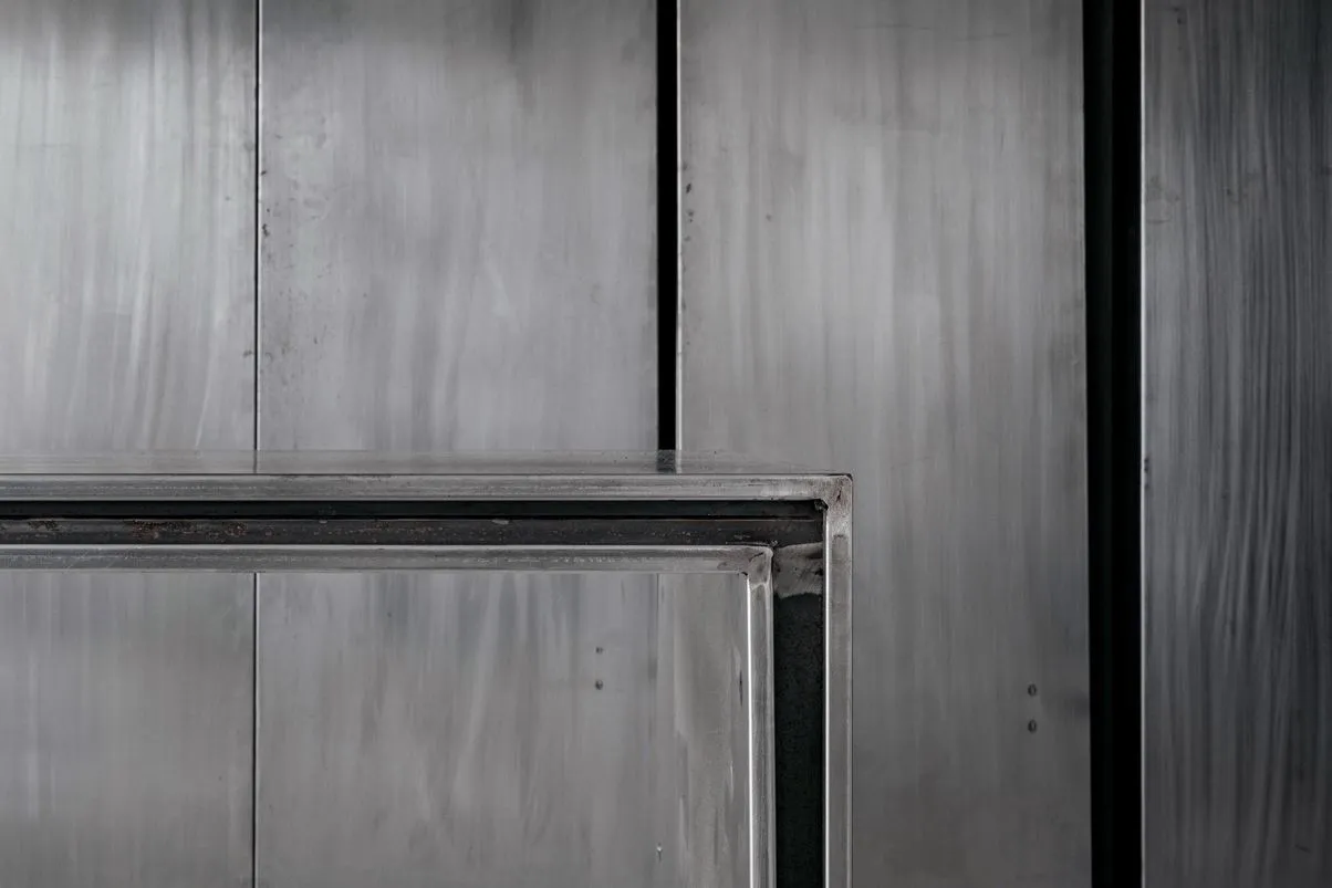 Metallic paneling with industrial design features