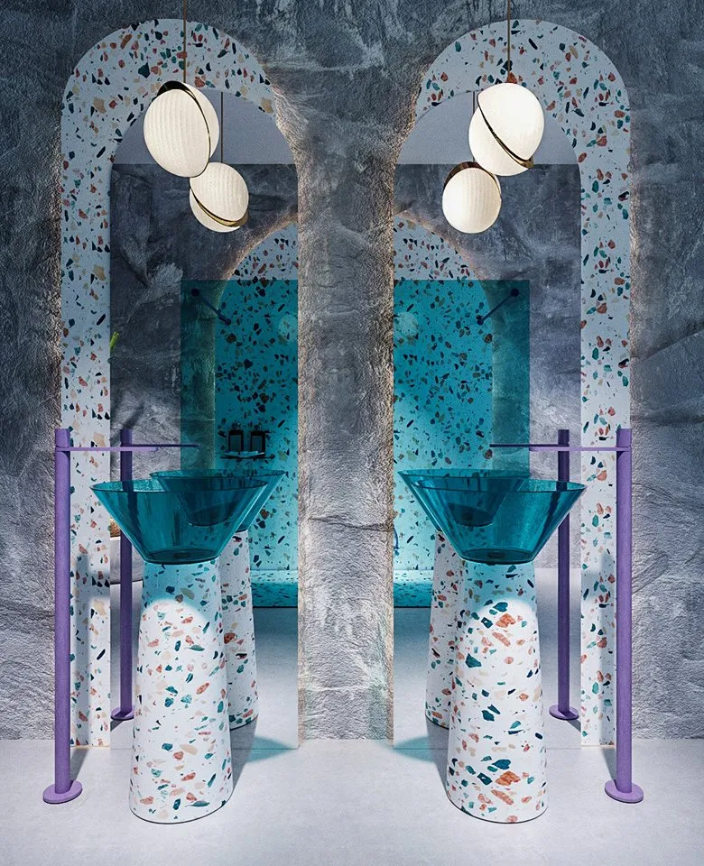 A modern bathroom with a terrazzo countertop and sink.