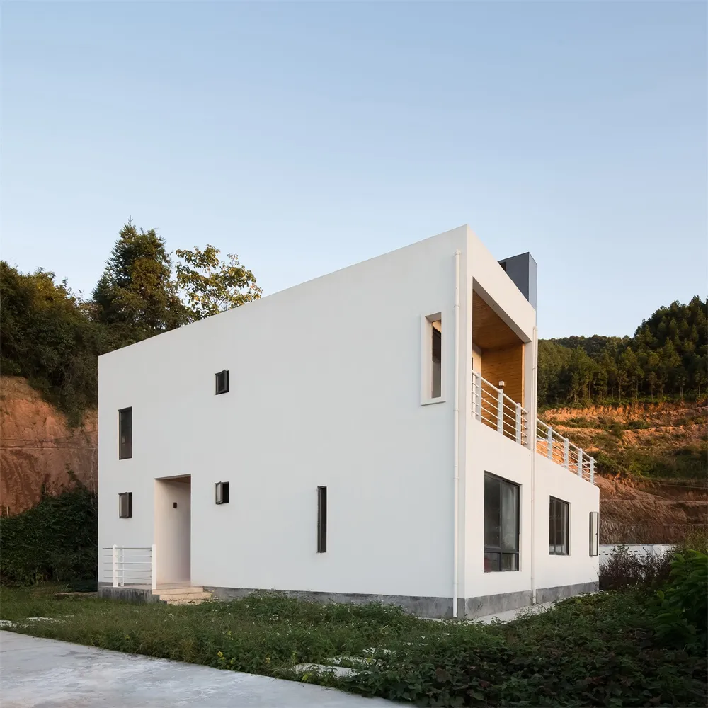 A minimalist white home with concrete and wooden elements.