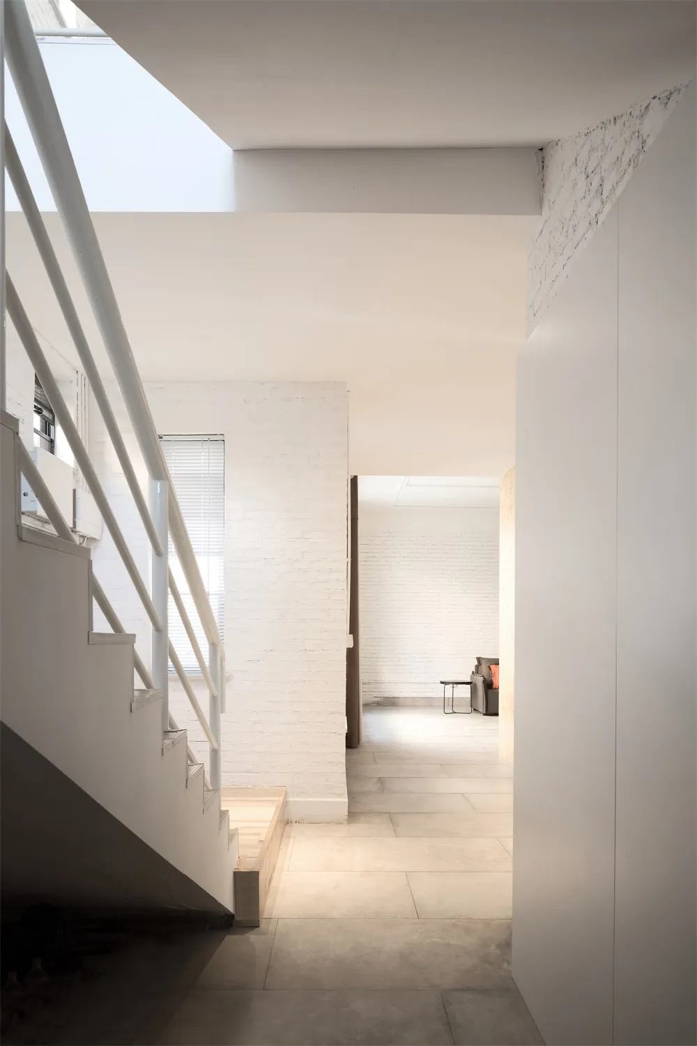 Photograph of a modern interior space with concrete elements.