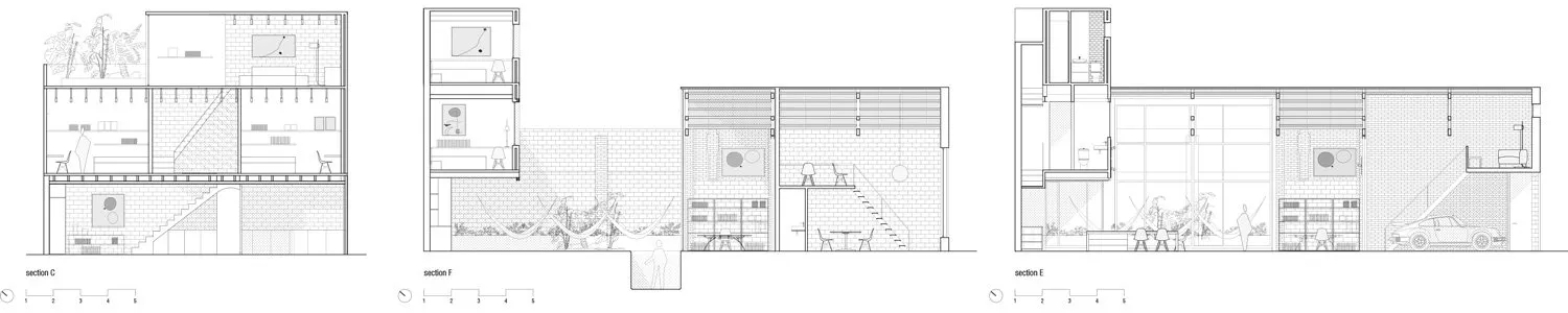 Modern interior design featuring a bright glass wall with a living room area and a staircase.