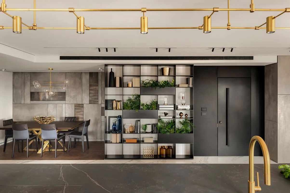 Modern interior with concrete walls, metal accents, and a mix of textures and colors.