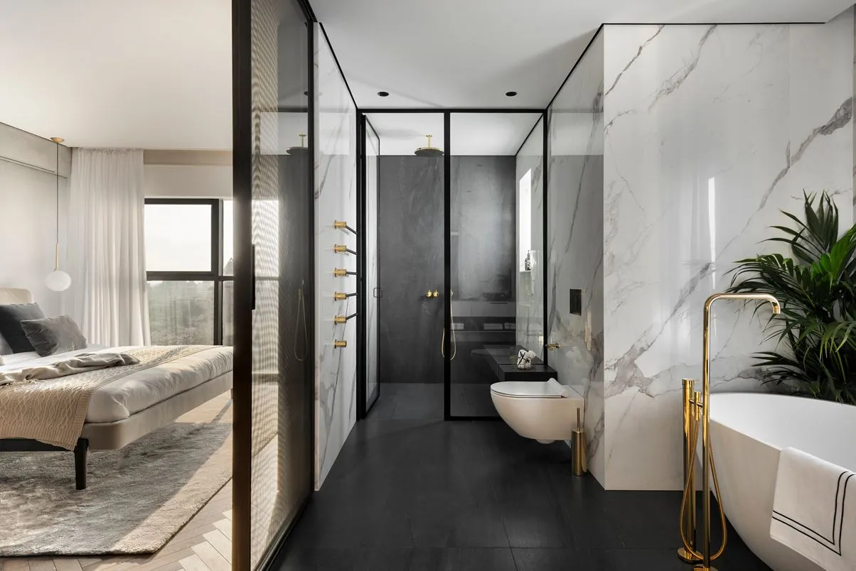 Modern bathroom featuring marble and glass materials, with a sleek, contemporary design.