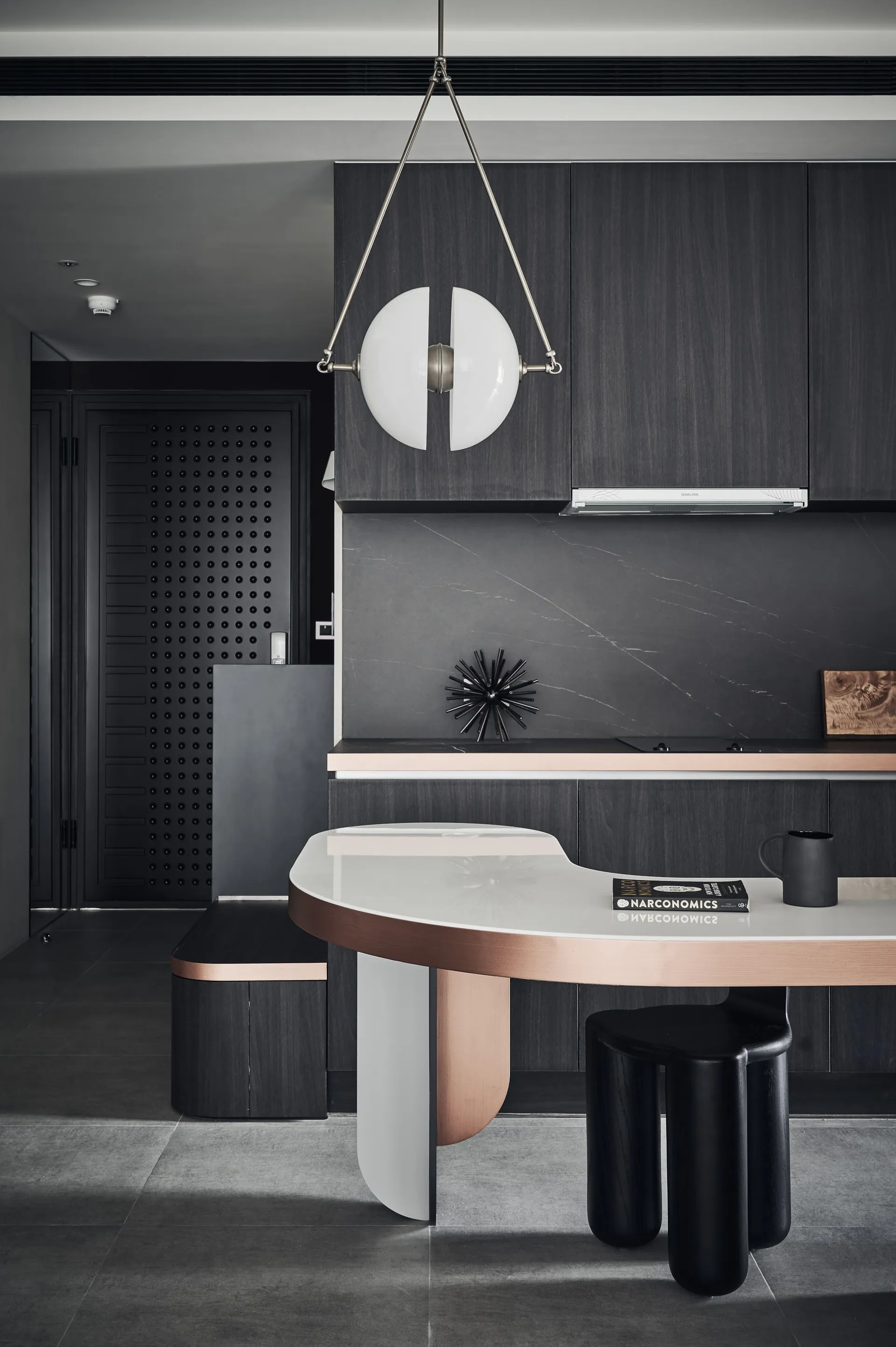 A modern kitchen featuring metallics and marble
