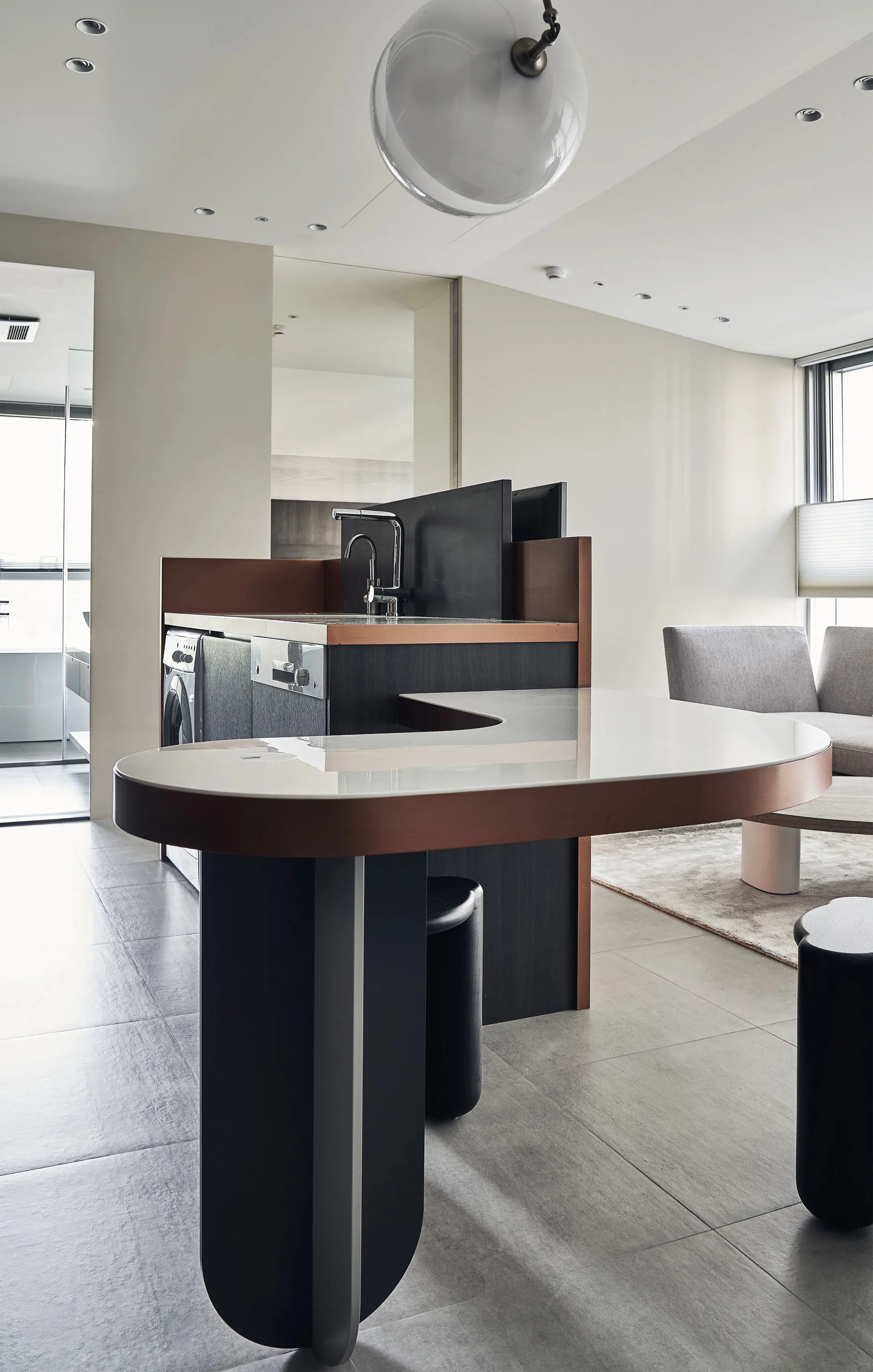 Modern residential kitchen with marble countertops and metal accents